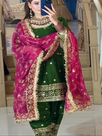 Woman in a green and pink traditional outfit Green pink patiala punjabi dhoti salwar suit in UK 