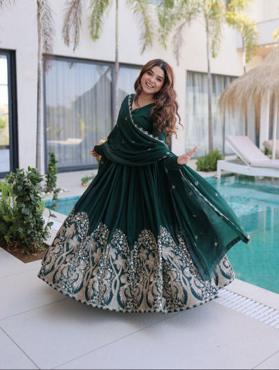 Woman in a green and white traditional outfit modest fashion in UK muslim eid alwar suit 